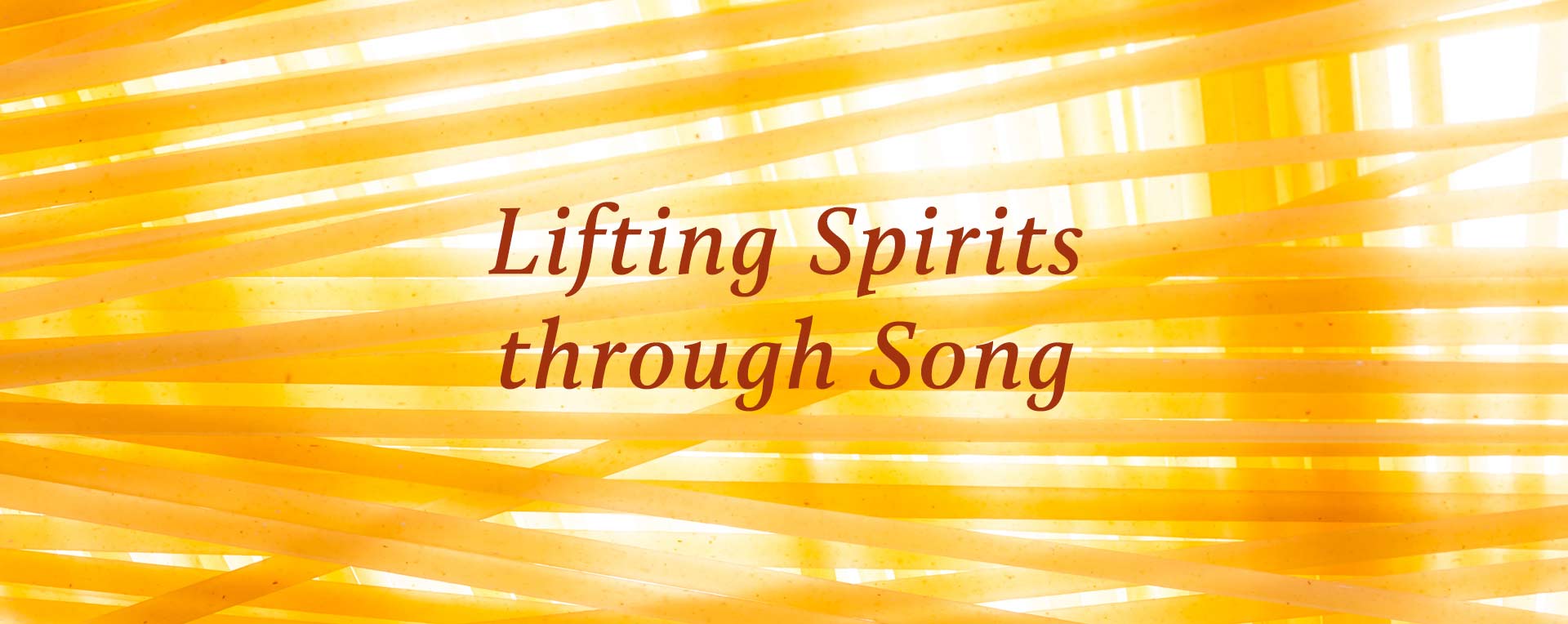 Lifting Spirit through Song printed in red with yellow striped background