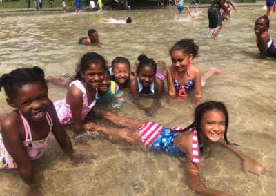 group of girls smiling in the water from Sister Mary Hart program