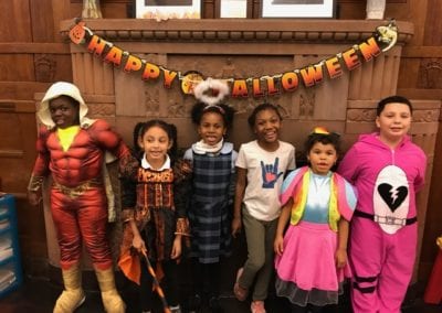 group photo of children dressed in Halloween costumes from Sister Mary Hart program